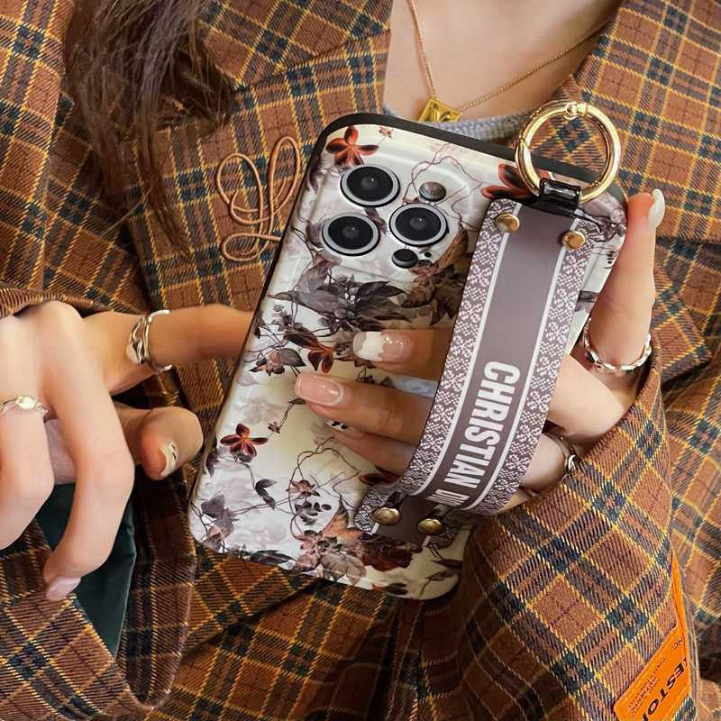 iPhone 16 series Luxury Brand CD White Floral Strap Belt Case Cover